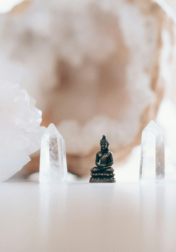 Metal - Acupuncture Classical Five-Element Graphic showing circle of The Five Element of Life Acupuncture: Metal: Clear crystals with statue of buddha